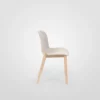A white chair with wooden legs on a white background.